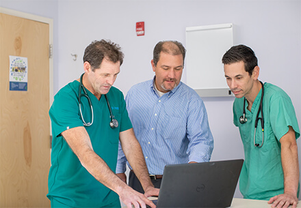 Commercial banking officer meeting with clients at medical office